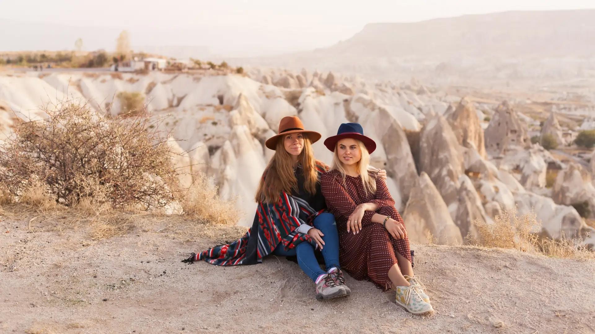 10-Day Private Turkey Highlights Tour : Young Ladies Watching Over Goreme Town at Love Valley
