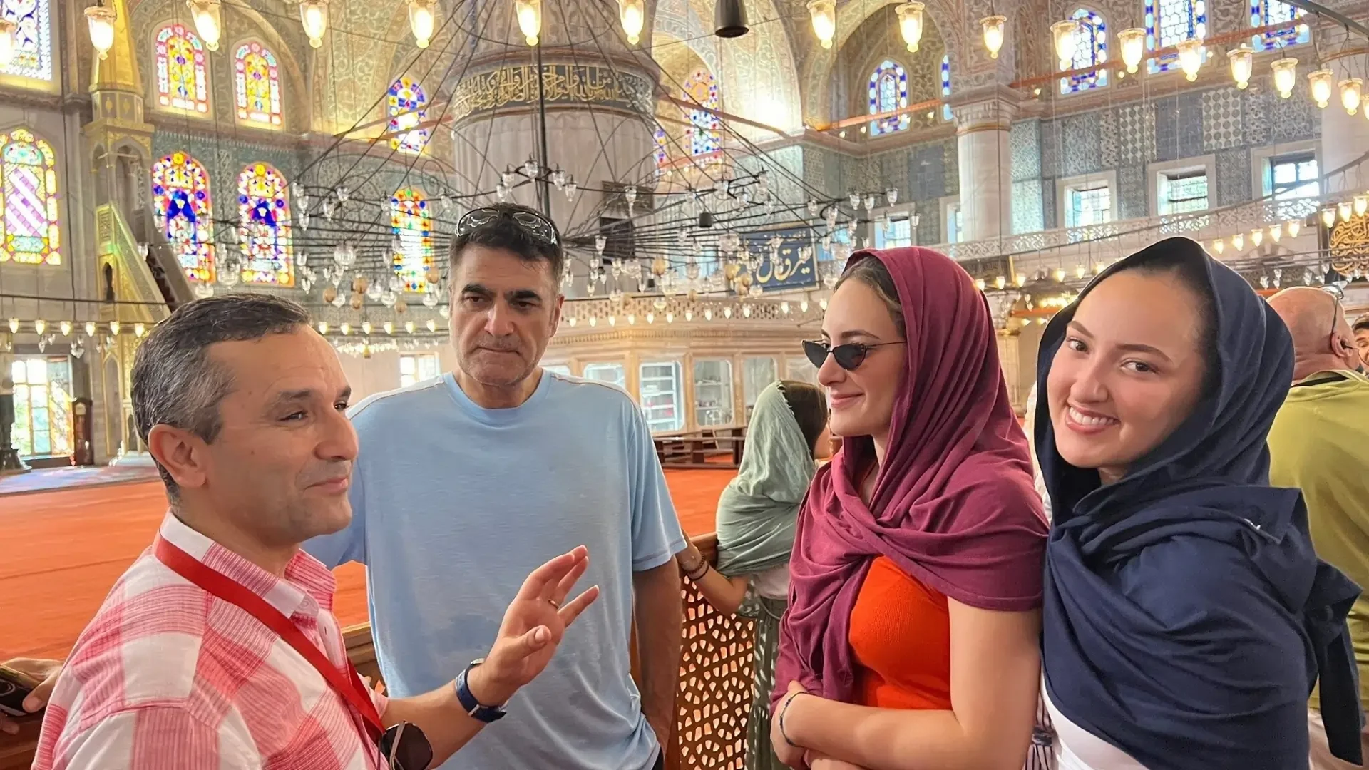 Private guide explaining the history and architecture of the Blue Mosque interior.