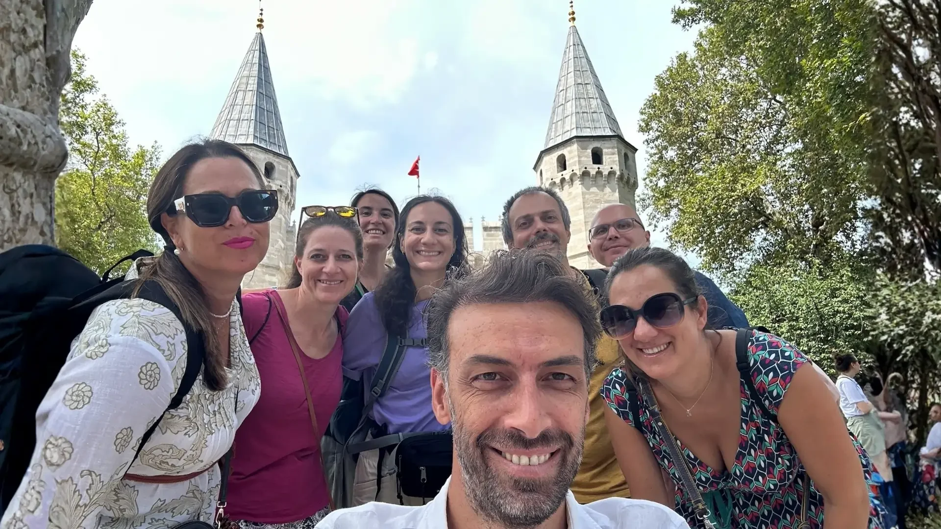 Private tour group visiting the historic entrance of Topkapi Palace in Istanbul.