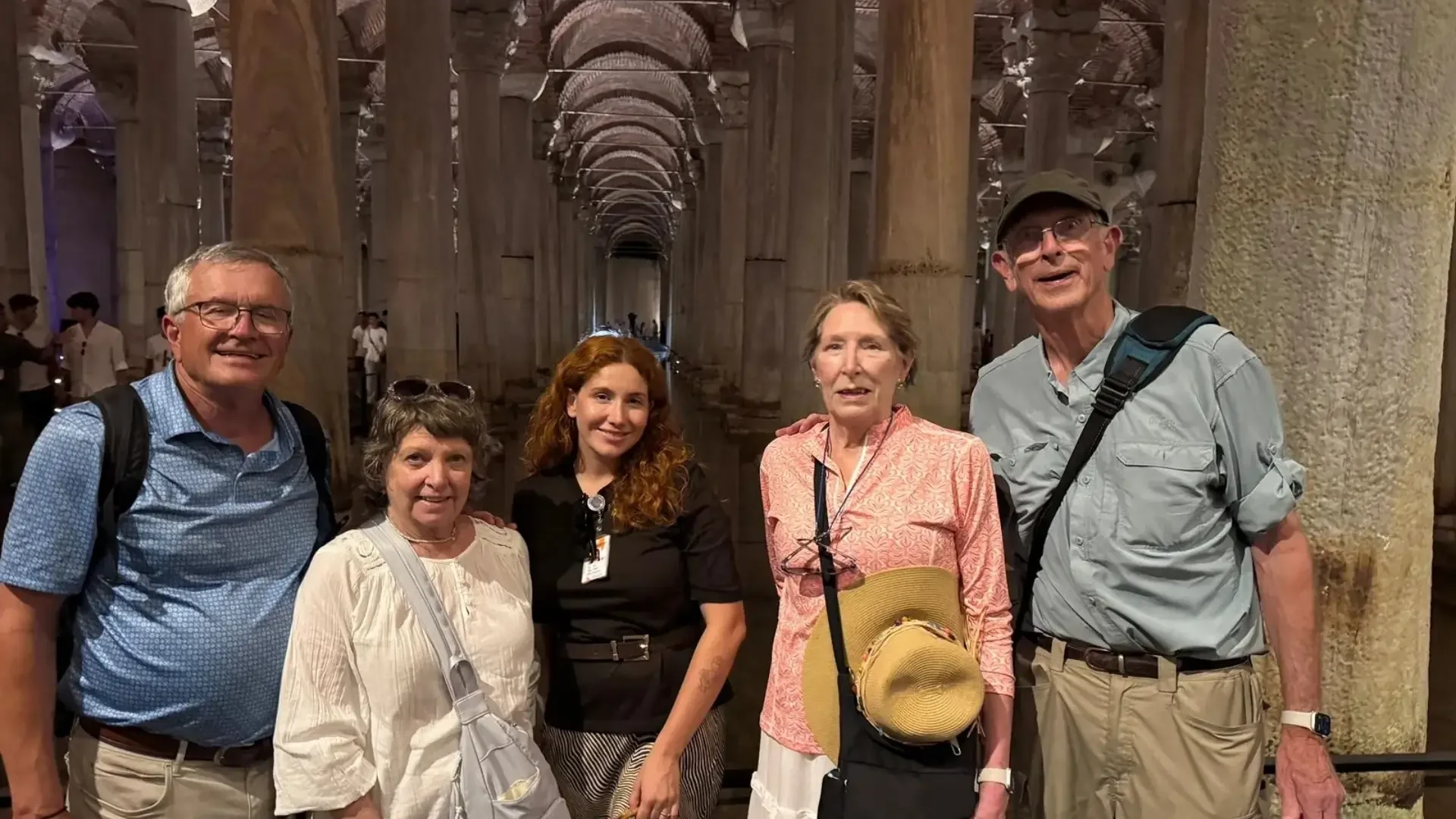 Guests and their private guide inside Istanbul’s atmospheric Basilica Cistern.